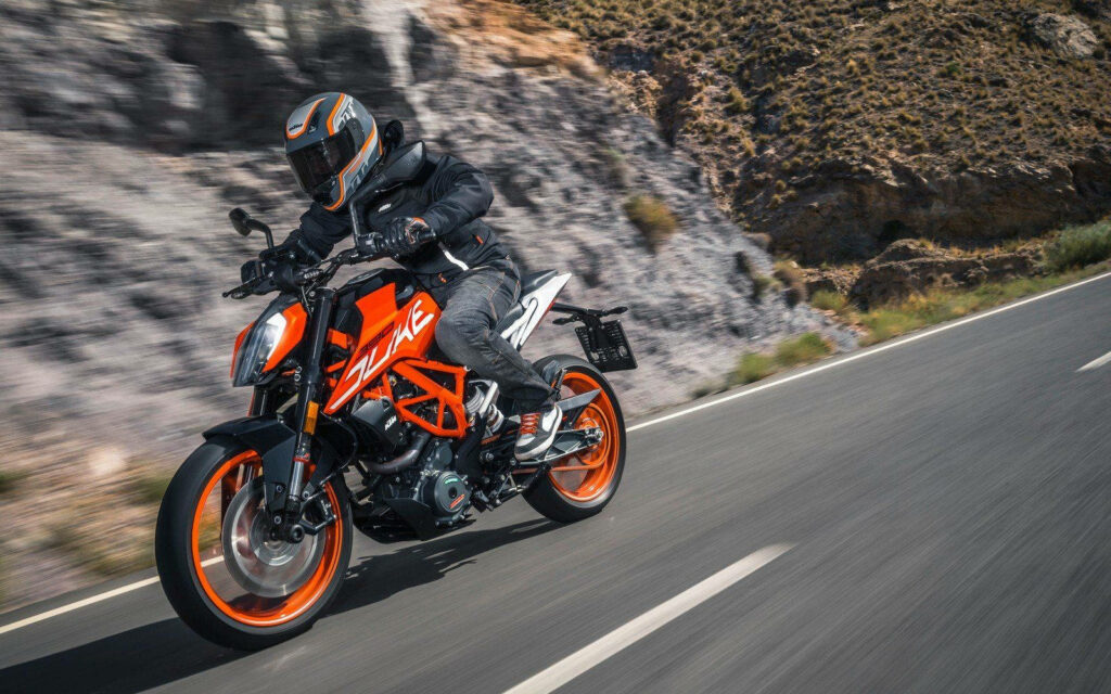 KTM Duke 390 Action Shot Wallpaper - Dynamic Motorcycle Aesthetic