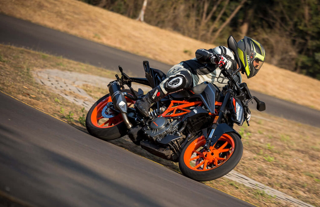 KTM Duke Motorcycle Wallpaper: Speed, Agility & Thrill in Curves