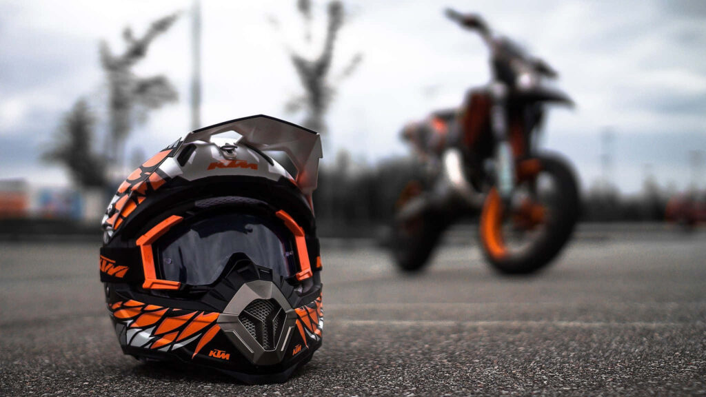 KTM-Themed Helmet Wallpaper: Exciting Bike Ride Background