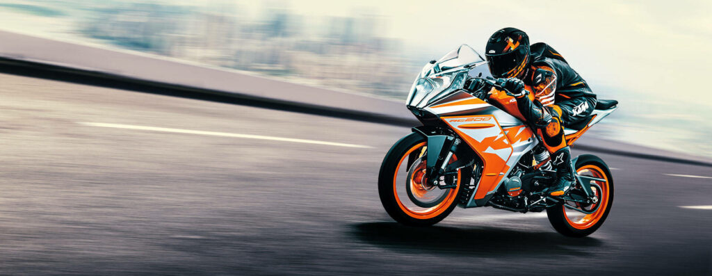Vibrant KTM RC 200 Wallpaper: Sporty Design in Motion