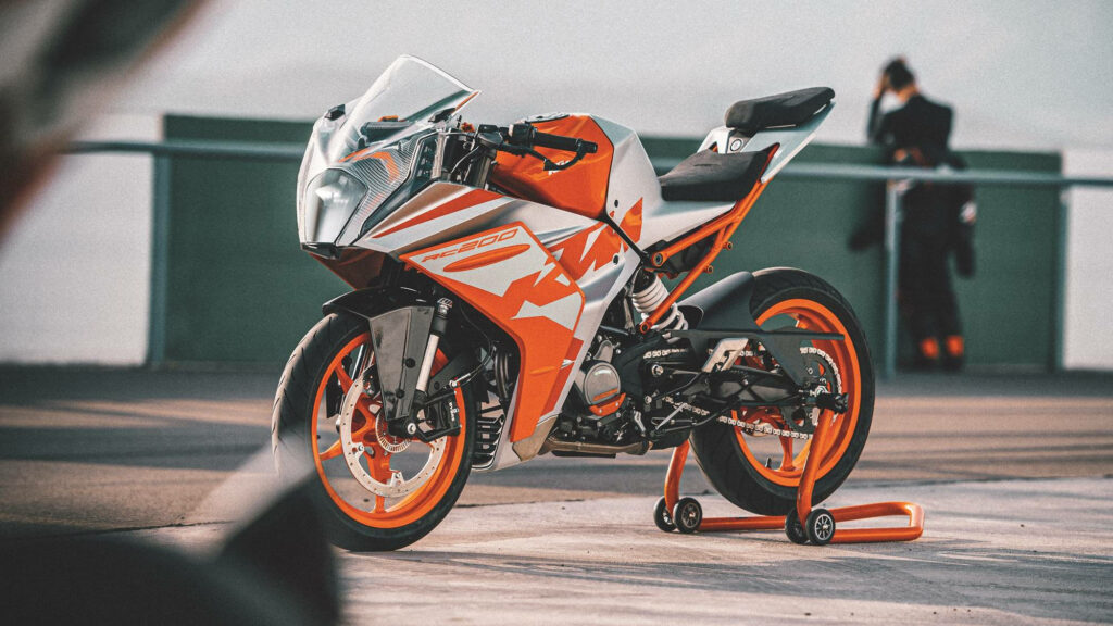 KTM RC 200 Wallpaper: Sporty Orange Motorcycle on Race Track