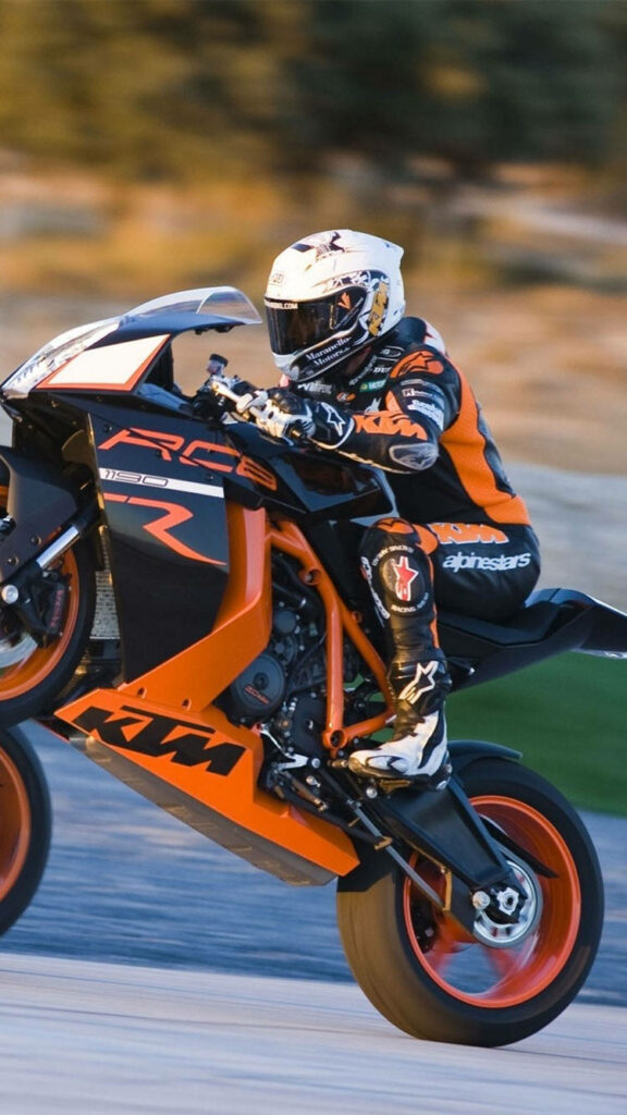 Dynamic KTM iPhone Wallpaper: Thrilling Orange and Black Motorcycle