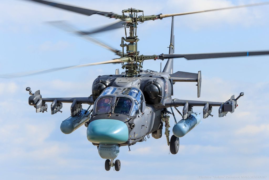 Ka-52 Alligator attack helicopter in flight with coaxial rotors and grey camouflage wallpaper