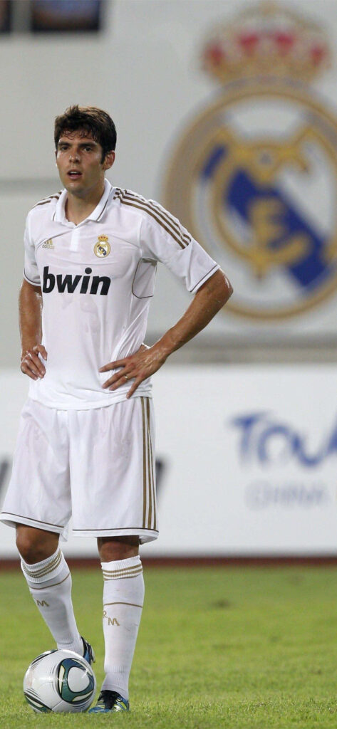 Kaká Wallpaper: Real Madrid Kit on Field with Club Emblem