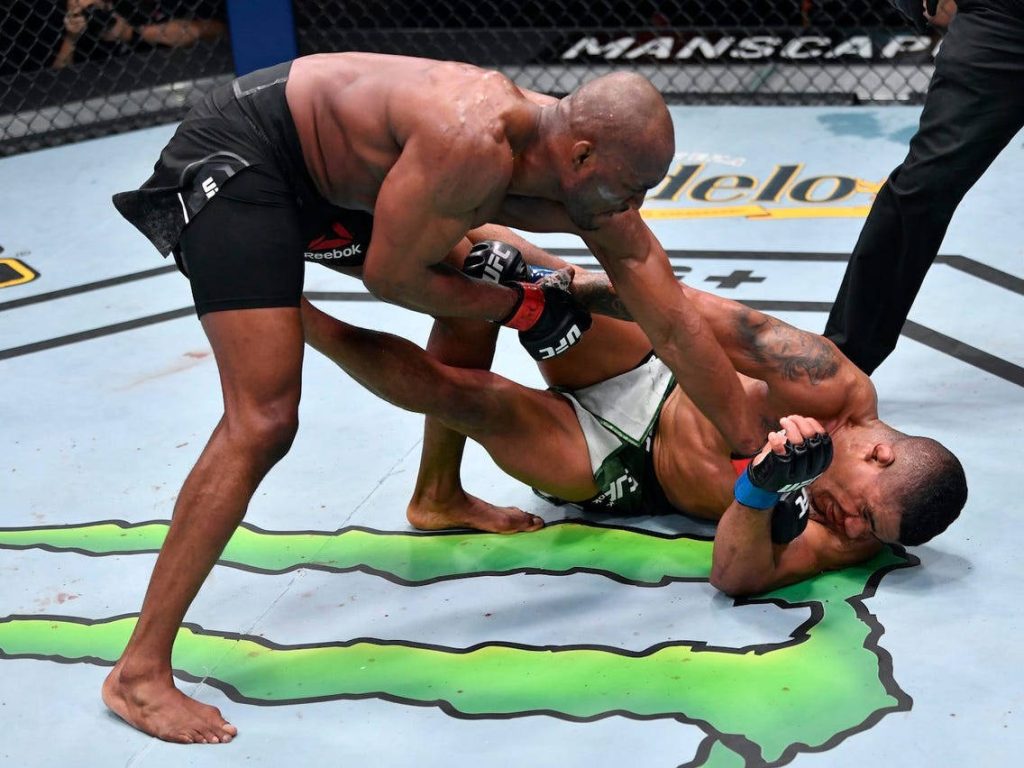 Kamaru Usman striking Gilbert Burns UFC 258 intense MMA fight wallpaper background