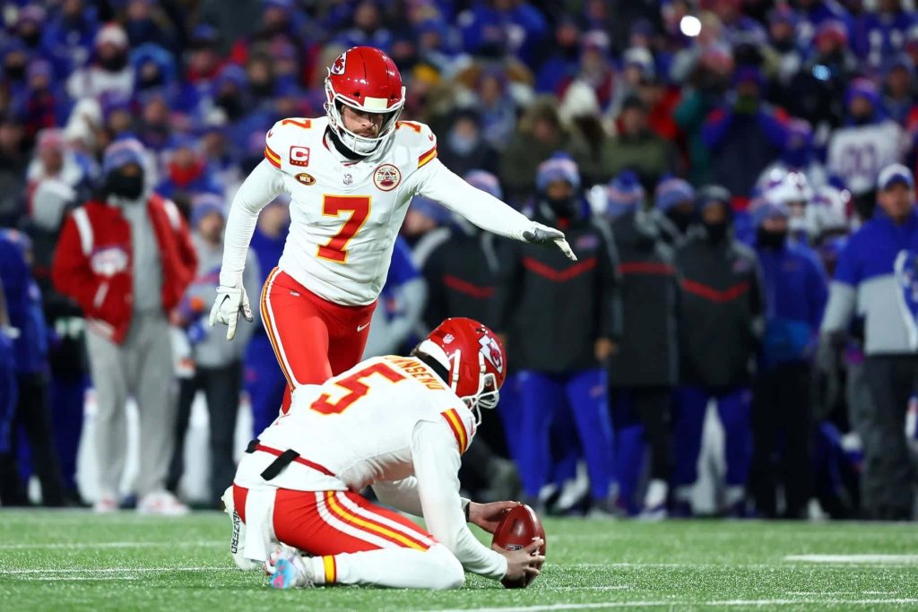 Kansas City Chiefs kicker Harrison Butker and Tommy Townsend prepare for field goal in NFL game Wallpaper