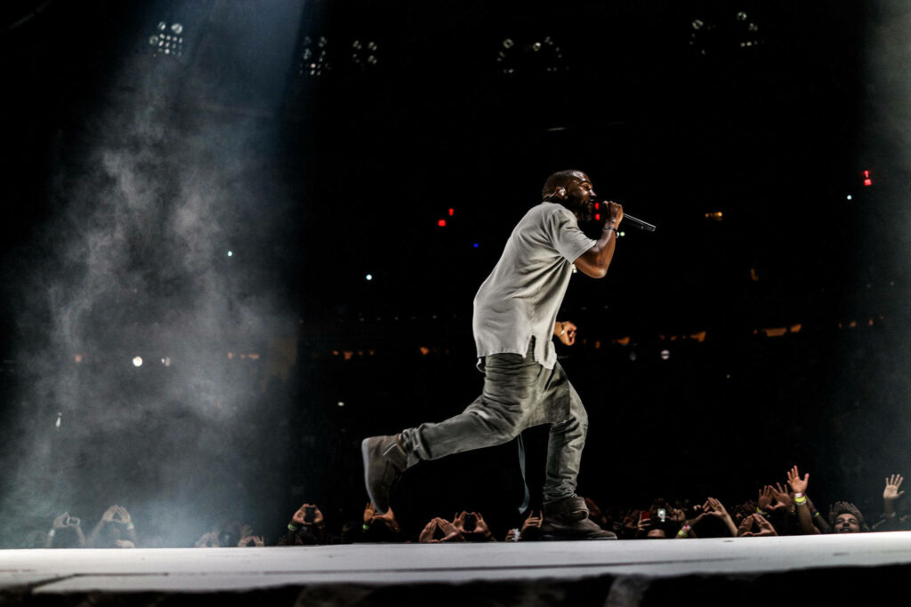 Kanye West Live Performance: Dynamic Stage Presence Wallpaper