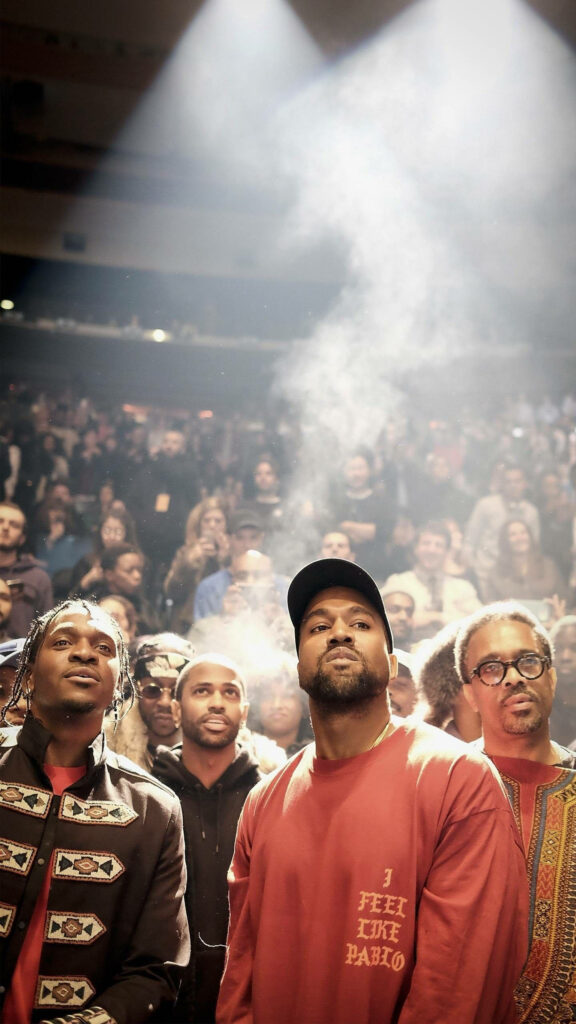 Dynamic Kanye West Wallpaper: Spotlight Energy in a Crowd