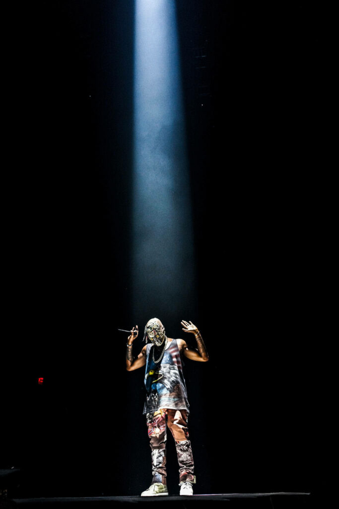 Kanye West Wallpaper: Dramatic Light & Artistic Intensity Background