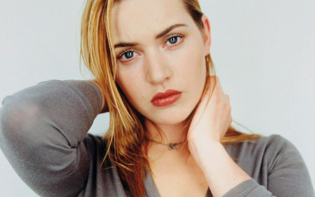 Close-up portrait of Kate Winslet showcasing expressive eyes and natural beauty wallpaper background