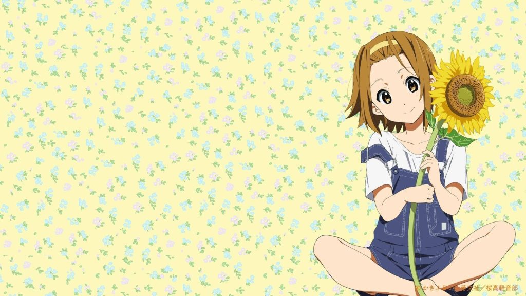 Kawaii anime wallpaper of Ritsu Tainaka holding sunflower on soft yellow floral background