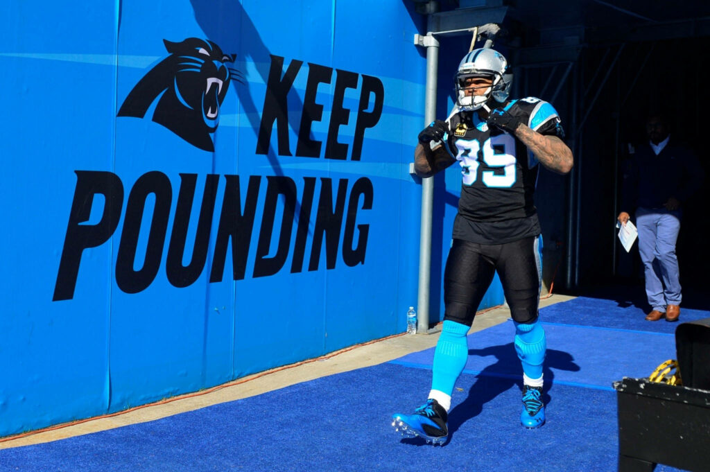 Carolina Panthers Kawann Short walking onto field with Keep Pounding blue NFL wallpaper background