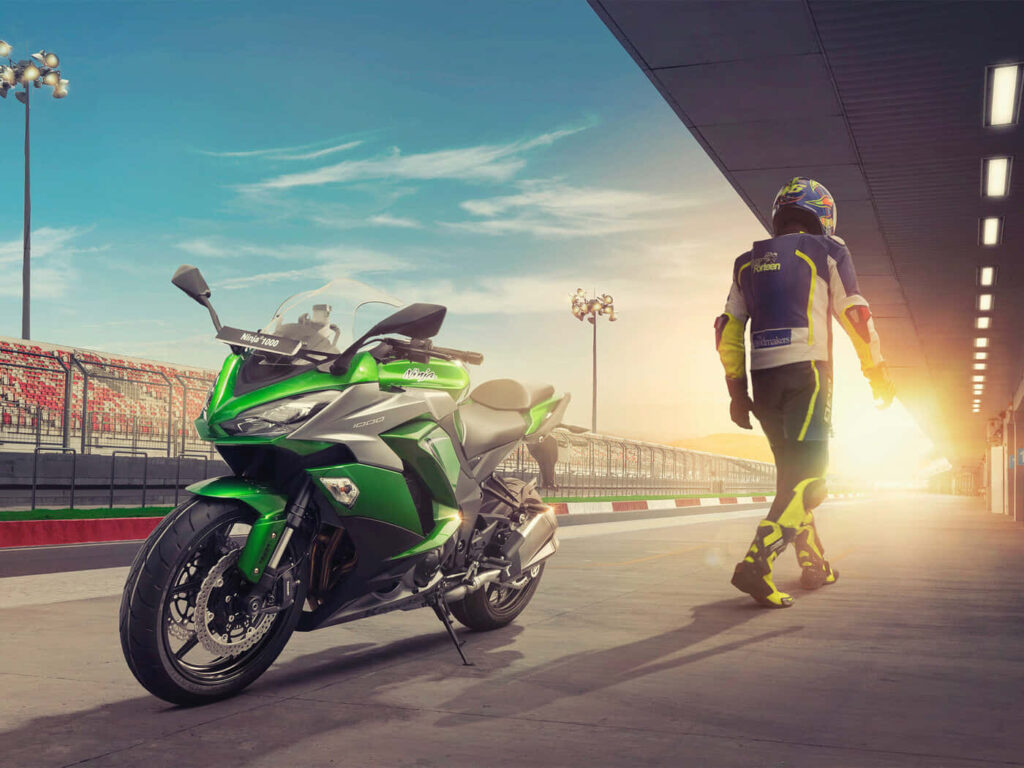 Stunning Kawasaki Motorcycle Wallpaper at Sunset in Racing Paddock