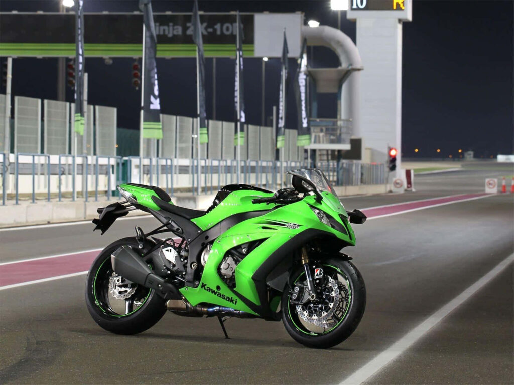 Iconic Kawasaki Ninja ZX10R Wallpaper: Sleek Night Racetrack Design