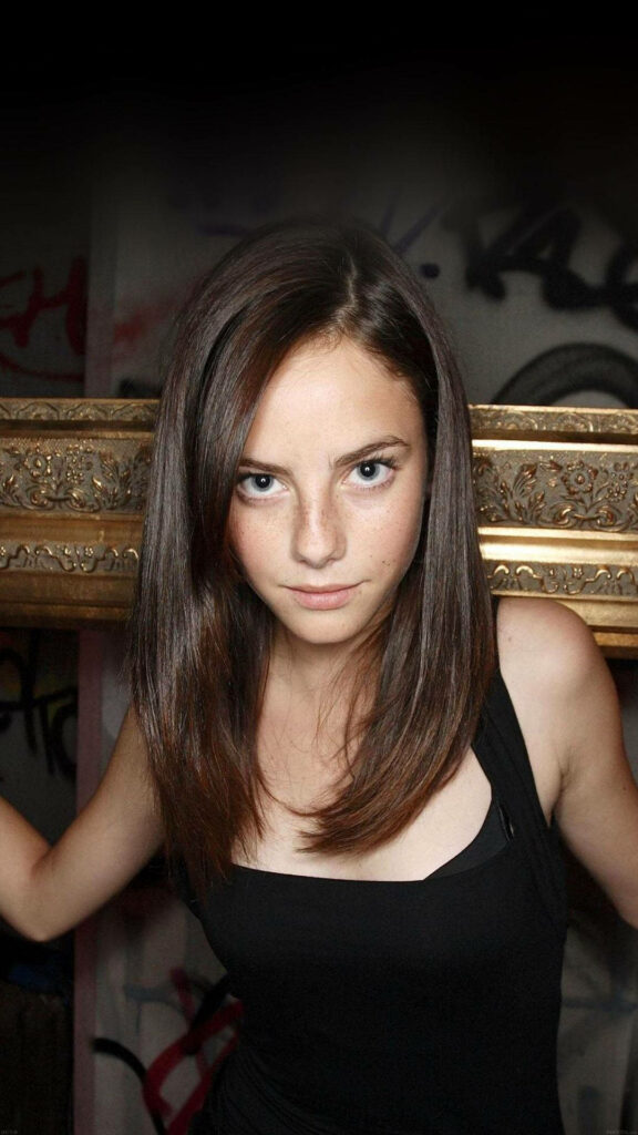 Kaya Scodelario intense portrait on dark artistic background striking wallpaper image