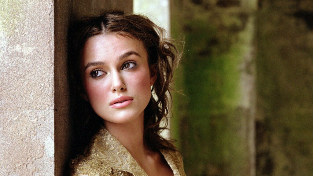Keira Knightley leaning against stone wall candid photoshoot natural beauty rustic background Wallpaper