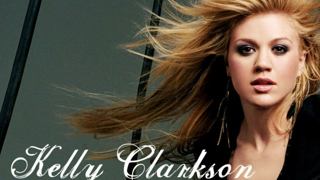 Kelly Clarkson wallpaper flowing hair confident expression dynamic music artist background