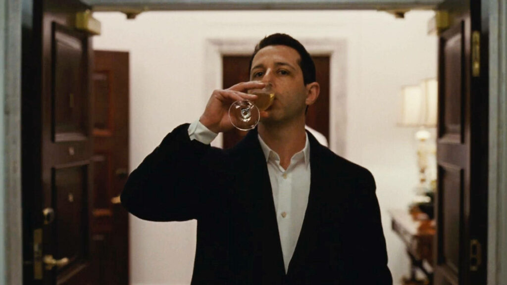 Kendall Roy Wallpaper: Elegant Sip in Formal Setting - Succession Vibe