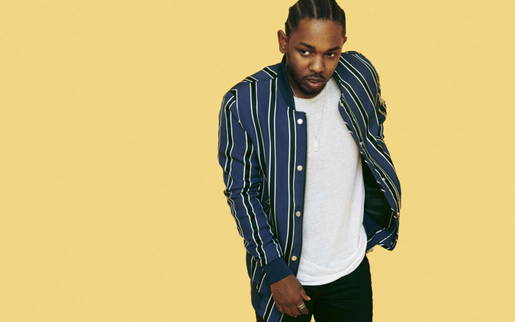 Kendrick Lamar Wallpaper: Stylish Striped Jacket on Bold Yellow Background