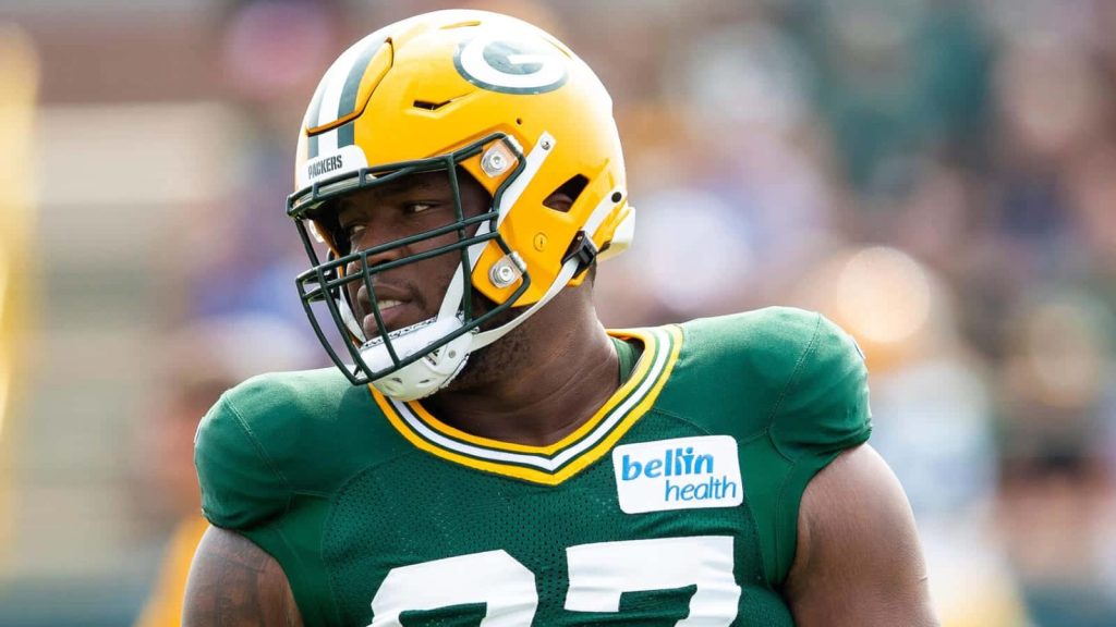 Kenny Clark Green Bay Packers defensive tackle in yellow green helmet and jersey NFL wallpaper