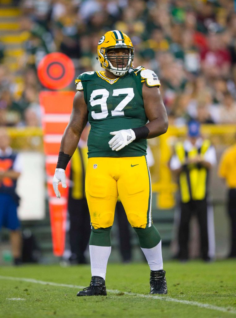 Kenny Clark Green Bay Packers defensive tackle number 97 in action on the football field wallpaper