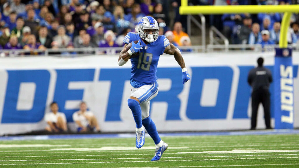Kenny Golladay in Action: Intense Detroit Lions Wallpaper Background