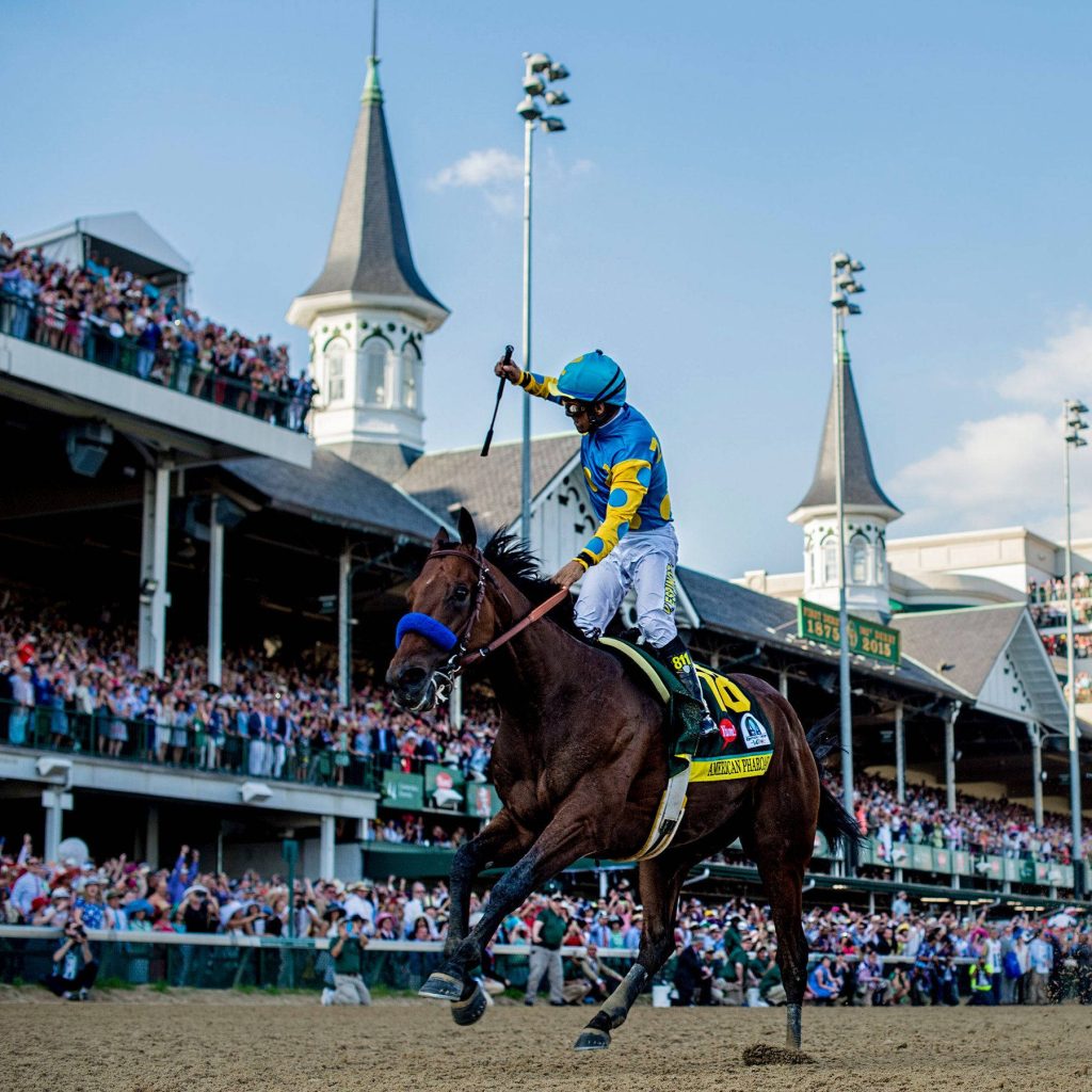 American Pharoah and jockey Victor Espinoza racing at Kentucky Derby Churchill Downs wallpaper