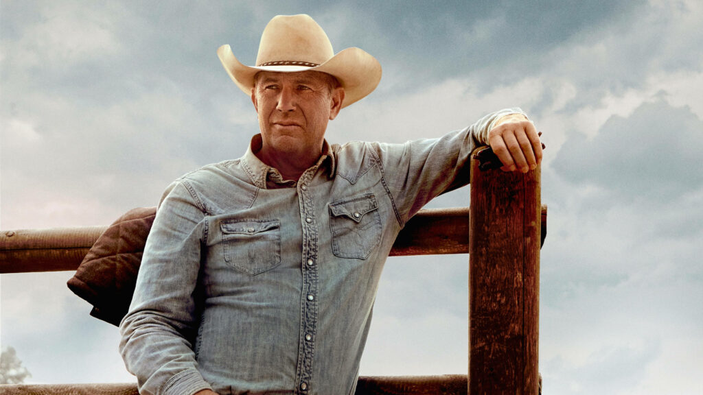Kevin Costner Yellowstone Wallpaper: Rugged Rancher Against Cloudy Sky