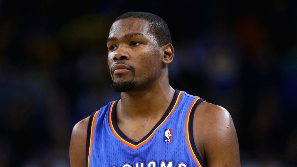 Kevin Durant Blue Jersey Wallpaper: Focused & Determined Background