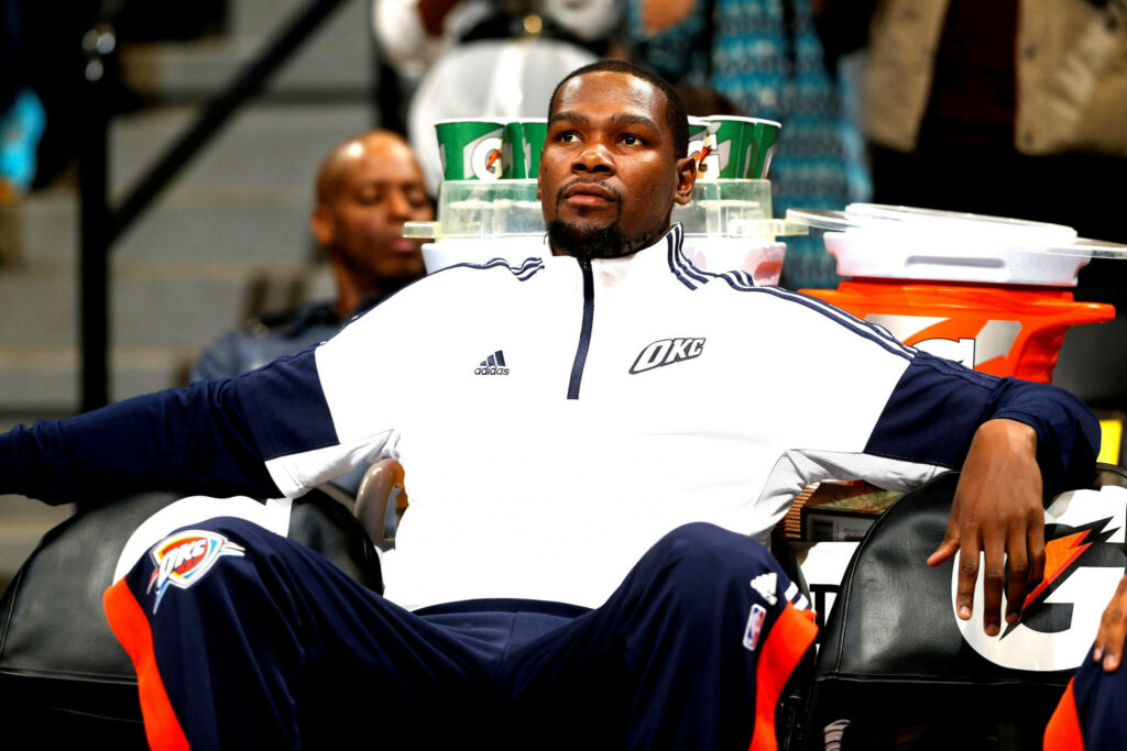 Kevin Durant Courtside in Thunder Tracksuit: Calm Confidence Wallpaper