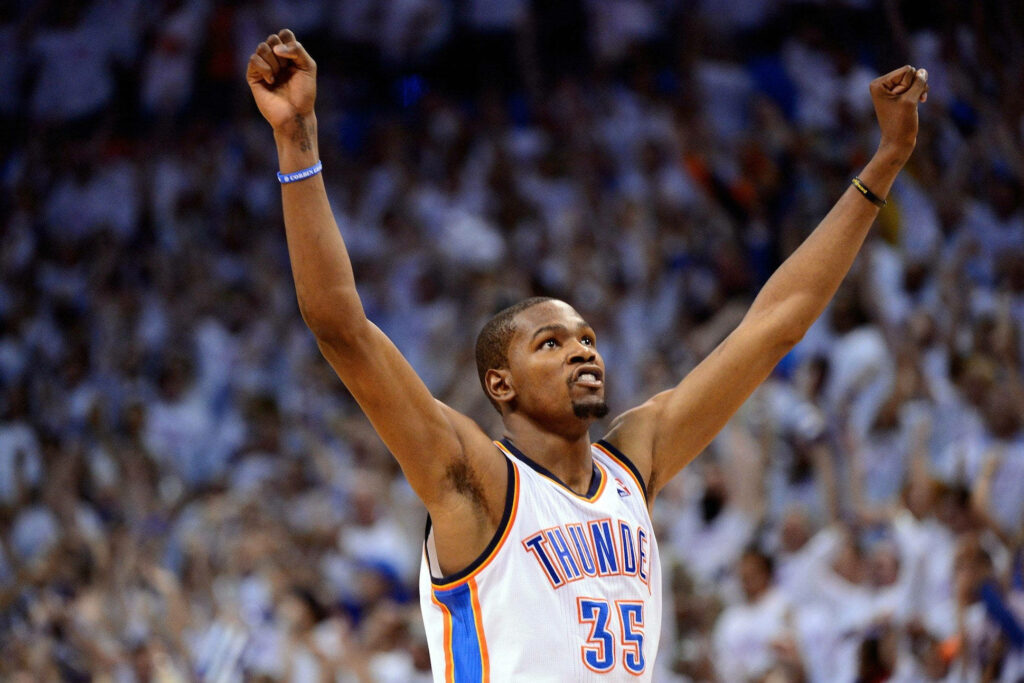 Kevin Durant Triumphs in Thunder Jersey - Stunning Wallpaper Background