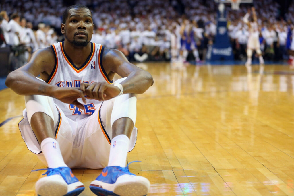 Kevin Durant on Court: Vibrant Game Atmosphere Wallpaper