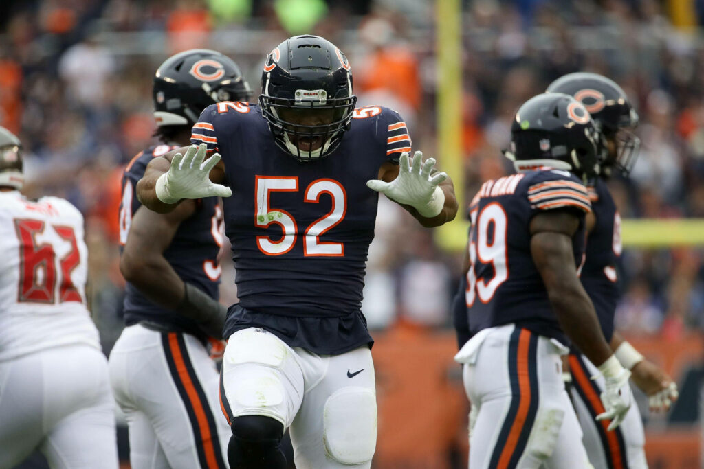 Khalil Mack Chicago Bears number 52 in action NFL game navy orange jersey stadium background Wallpaper