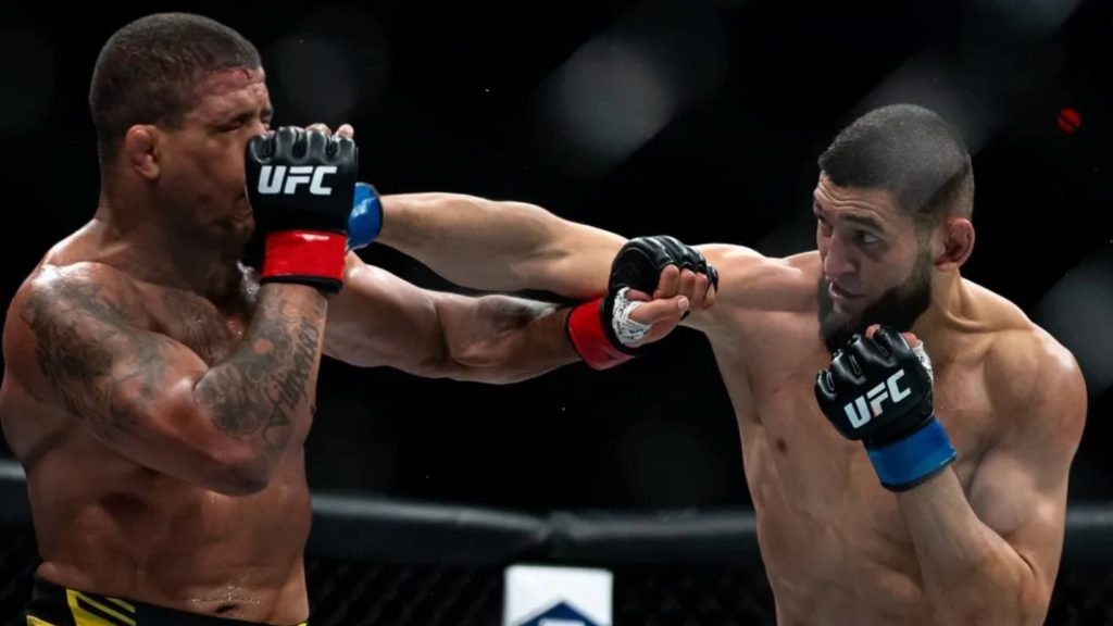 Khamzat Chimaev lands a punch on Gilbert Burns in intense UFC Octagon fight wallpaper background