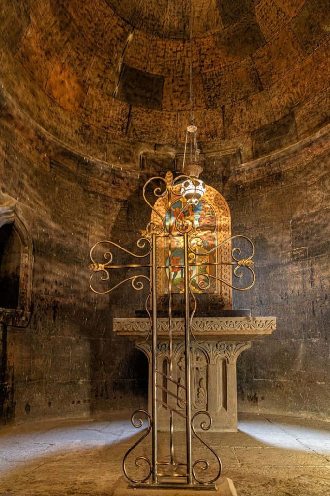 Wrought iron cross at historic Khor Virap Monastery stone altar ancient Armenian dungeon wallpaper