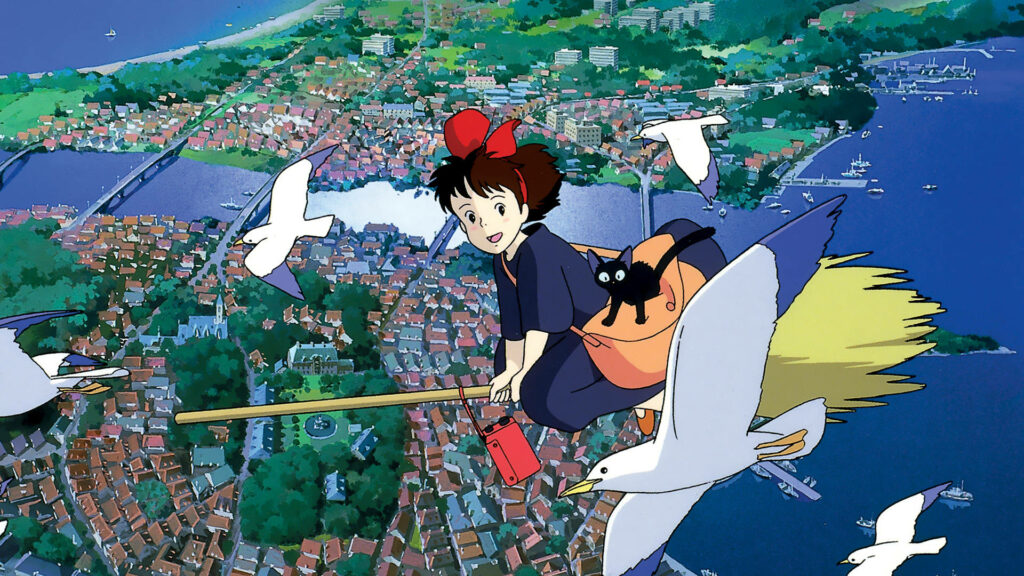 Kiki Flying on Broomstick with Birds: Stunning Coastal Town Wallpaper