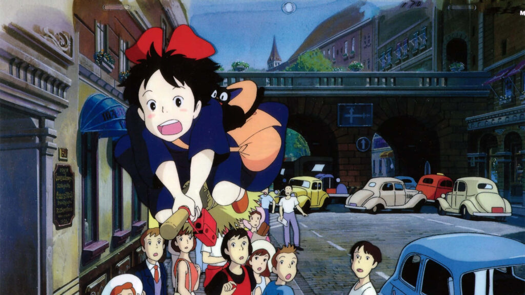 Magical Kiki Flying with Jiji Over Bustling City - Wallpaper Background