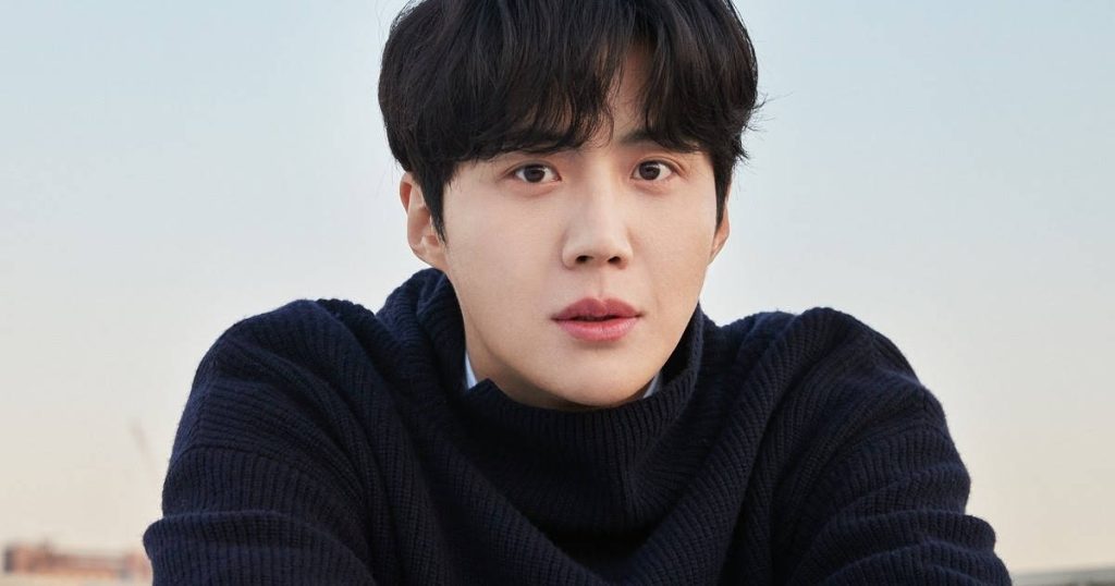 Kim Seon-ho portrait in soft light wearing navy sweater serene aesthetic wallpaper background
