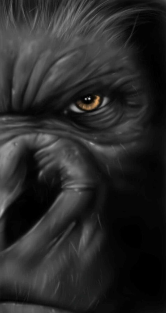 Close-up of King Kong intense gaze showing raw power and emotion dramatic wallpaper background