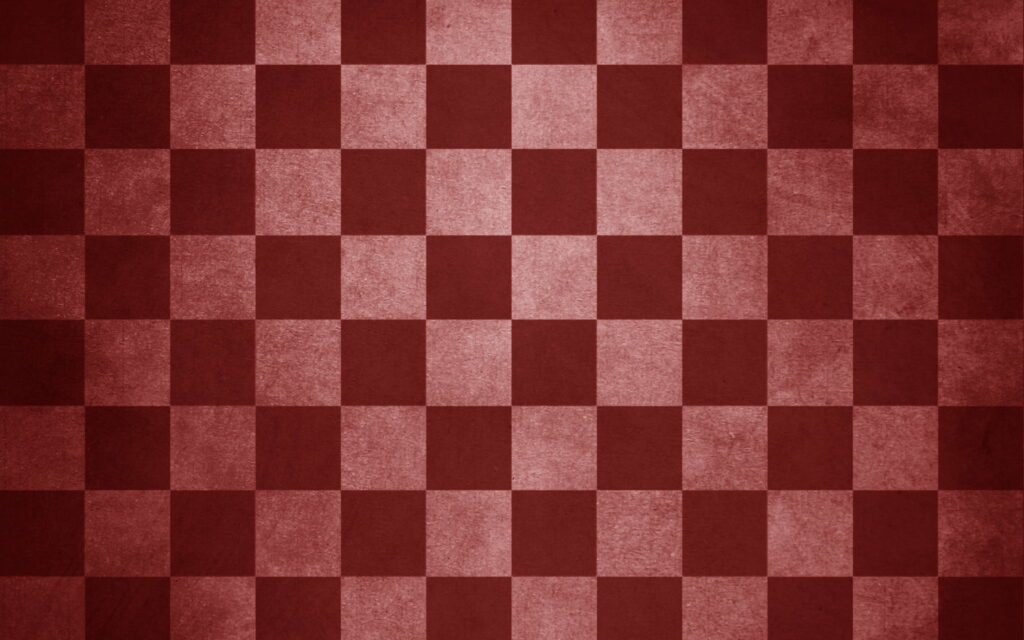Strategic Battle on a Vibrant Red Checkered Chessboard: 4K Wallpaper