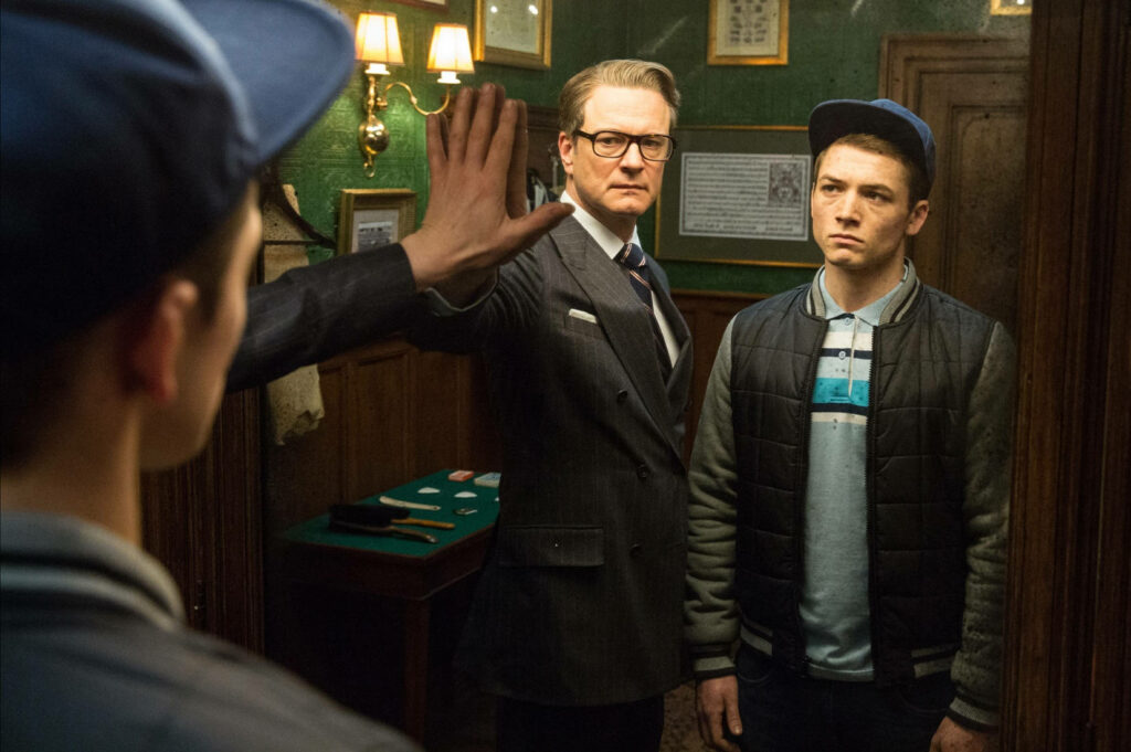 Kingsman The Secret Service two characters facing mirror in stylish mysterious detailed room wallpaper