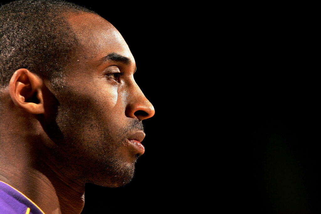Kobe Bryant intense profile portrait high contrast studio black background NBA legend wallpaper