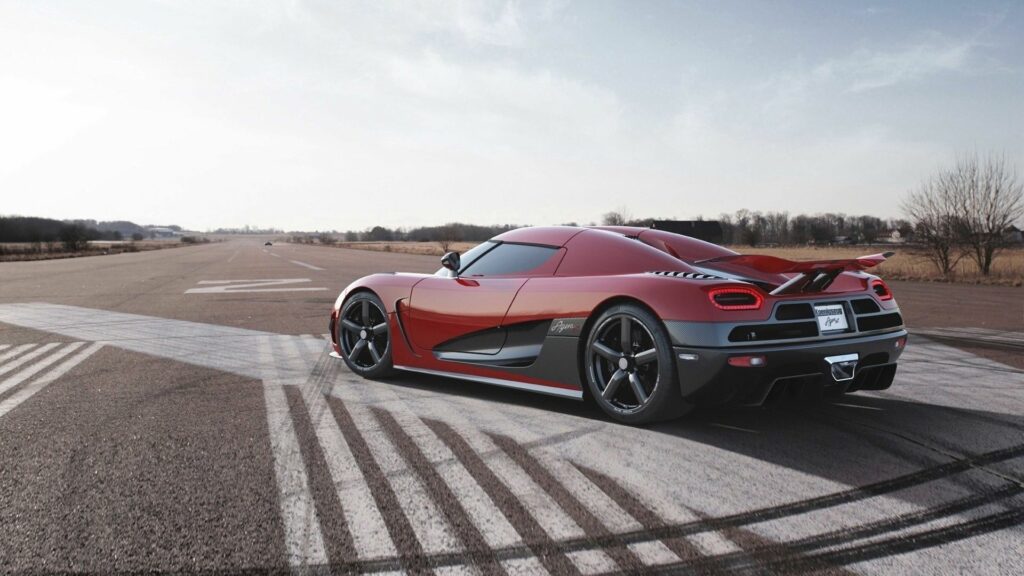 Koenigsegg Agera R: 2013 Hypercar on Runway – Bold Red Luxury Wallpaper