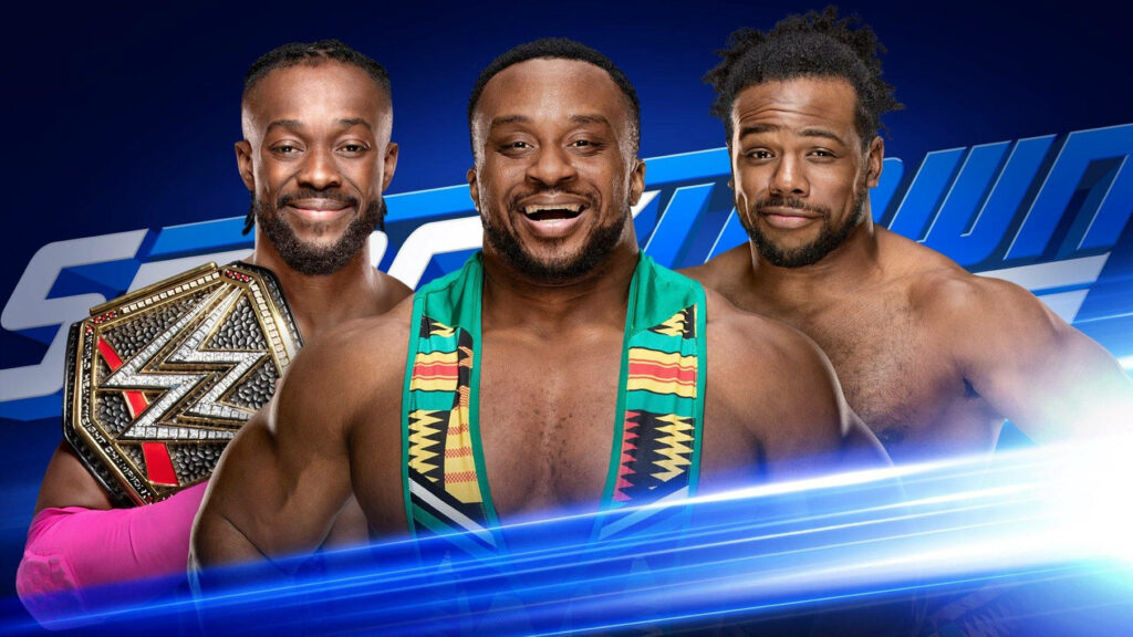 Kofi Kingston Big E and Xavier Woods SmackDown team smiling united vibrant blue background wallpaper