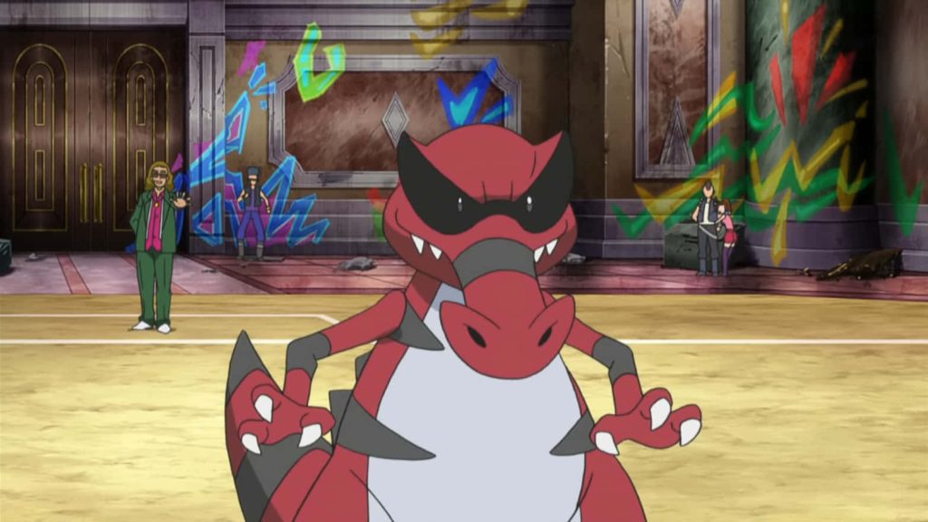 Krookodile Pokémon final evolution with red scales in vibrant arena anime wallpaper background
