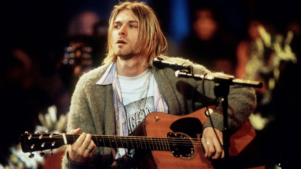 Melancholy Melodies: Captivating Kurt Cobain Portrait in QHD Music Wallpaper
