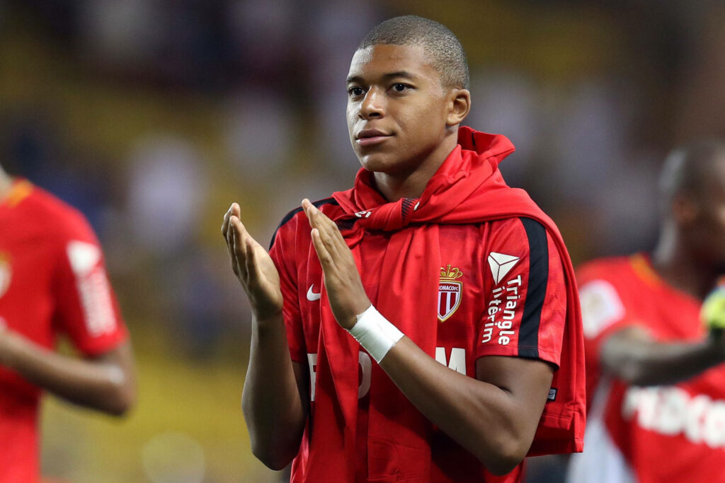 Kylian Mbappe Clapping in Red AS Monaco Jersey - Wallpaper Background