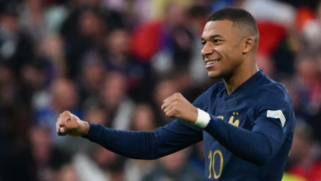 Dynamic Kylian Mbappe Wallpaper: Vibrant France Football Background