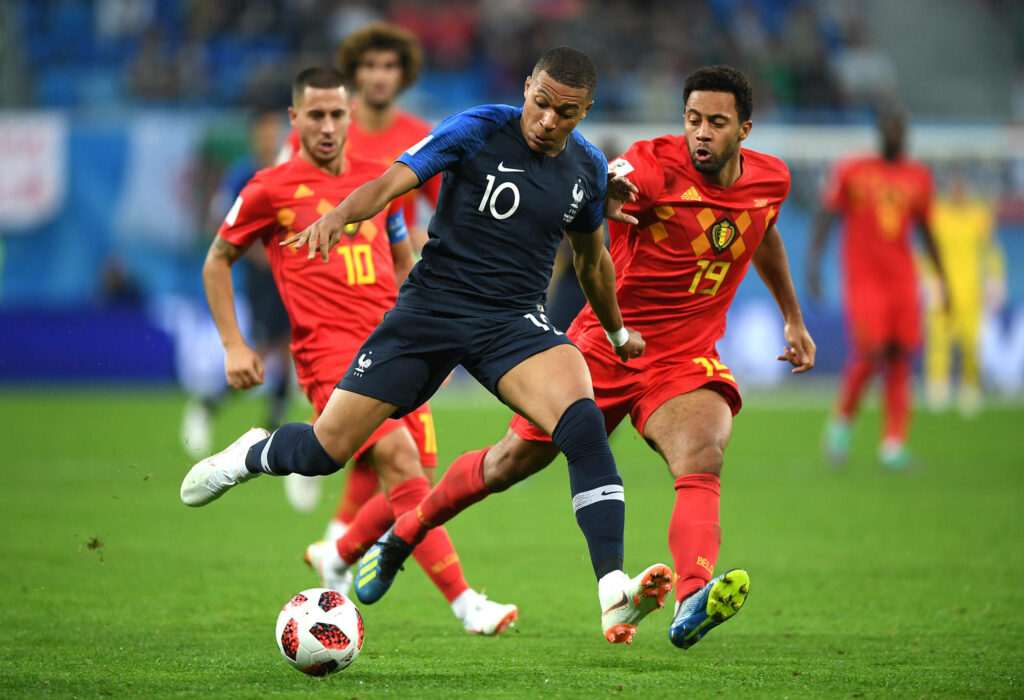 Dynamic Kylian Mbappe Soccer Wallpaper: Precision in Action