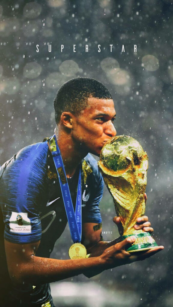 High-Res Kylian Mbappé Celebrates with FIFA World Cup Trophy Wallpaper